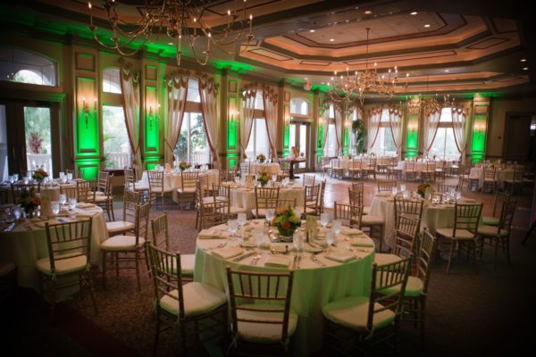 Green uplighting decor for wedding